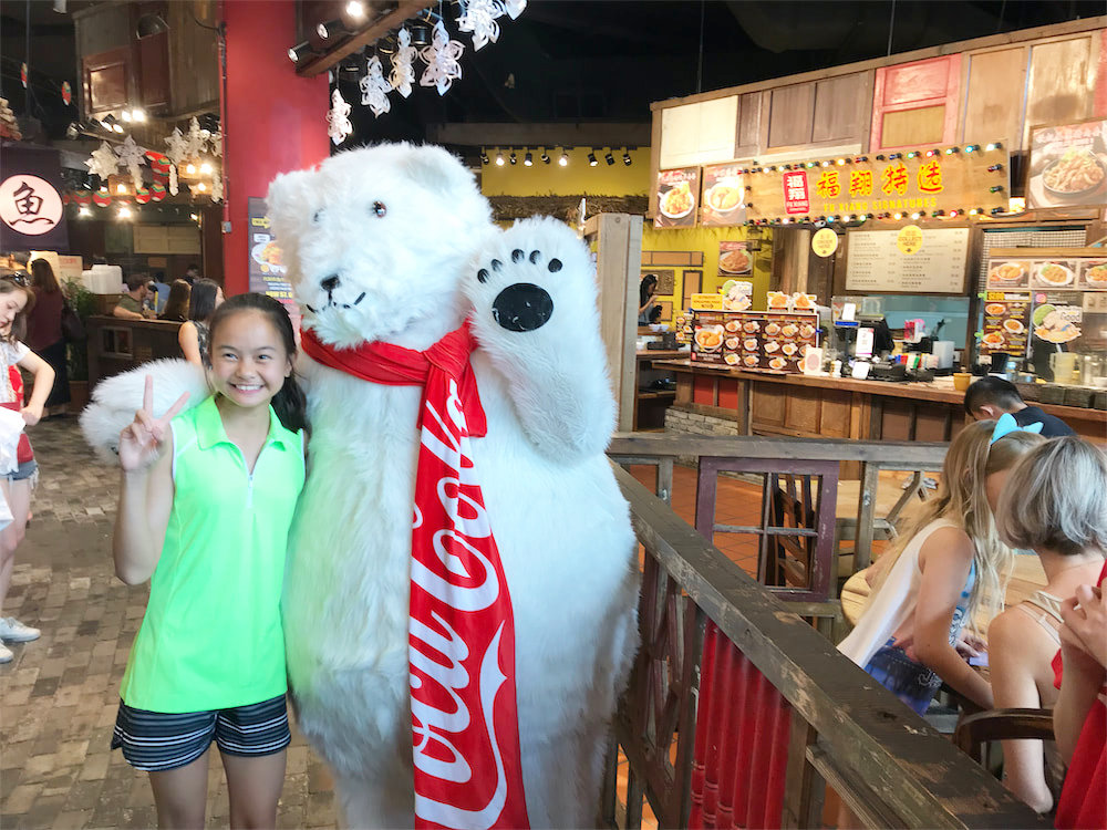Coke bear at food republic events marketing posing for photo with customer